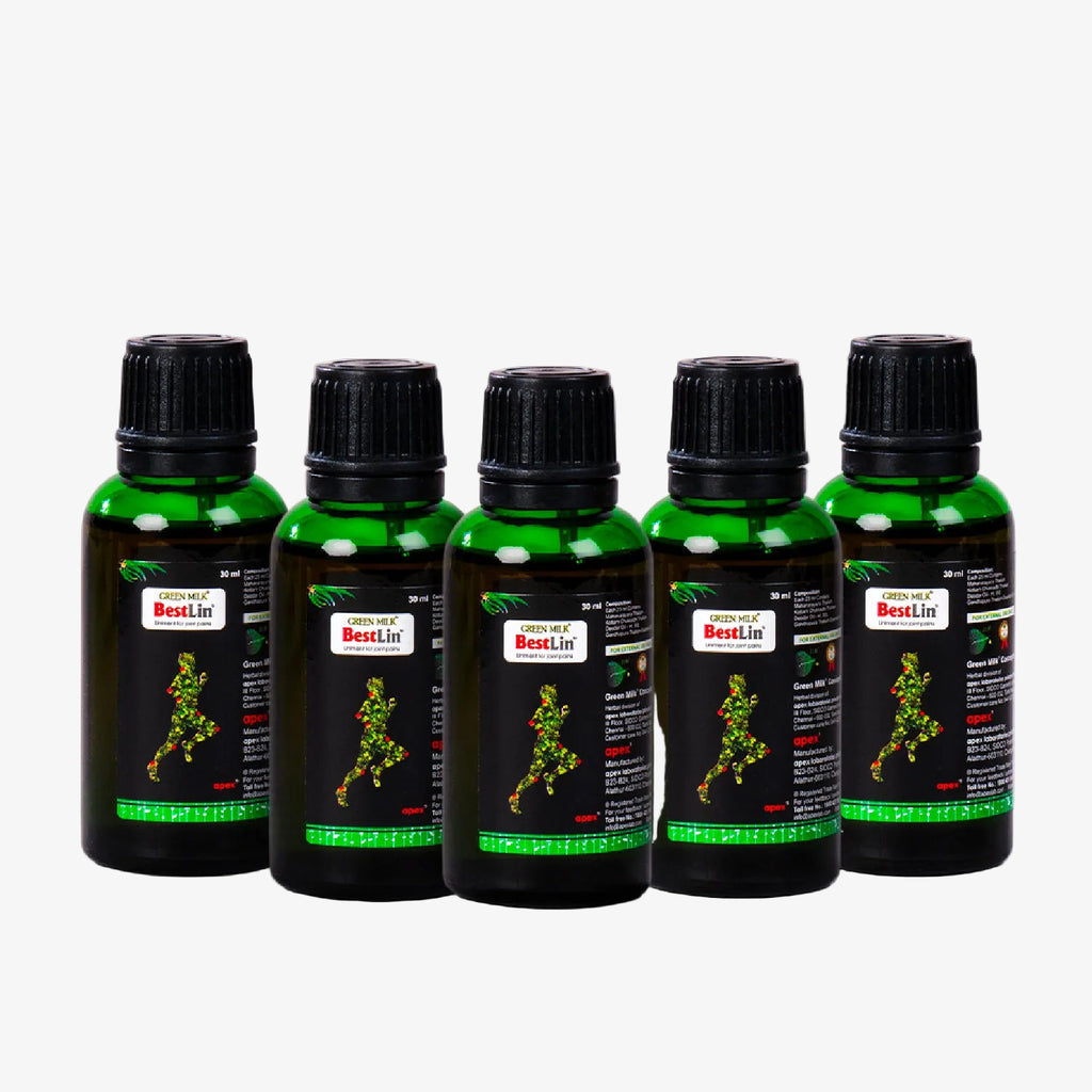 Five green bottles with black caps on a white background